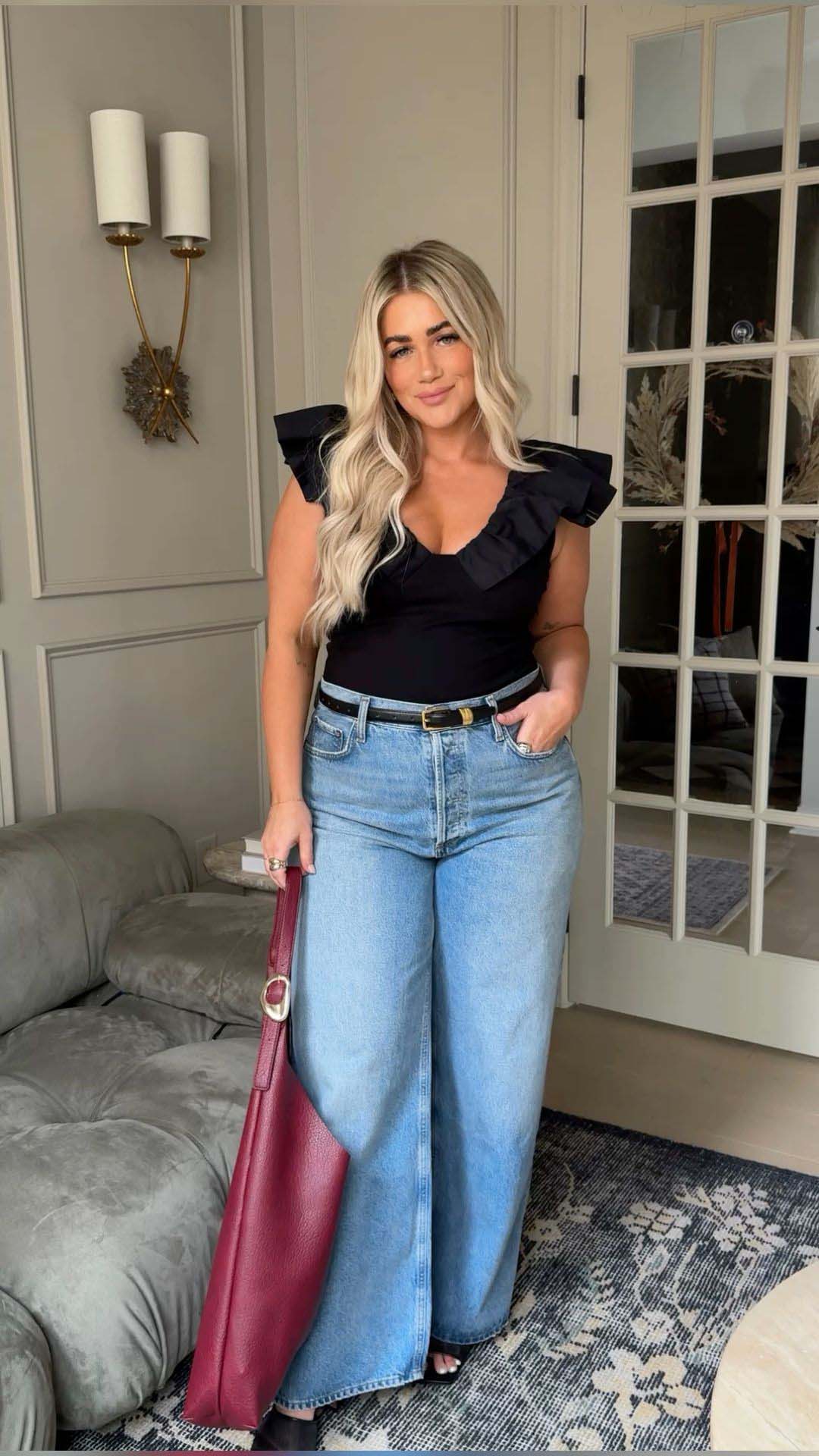 Black Ruffle Top + High-Waisted Wide-Leg Jeans + Burgundy Tote Bag